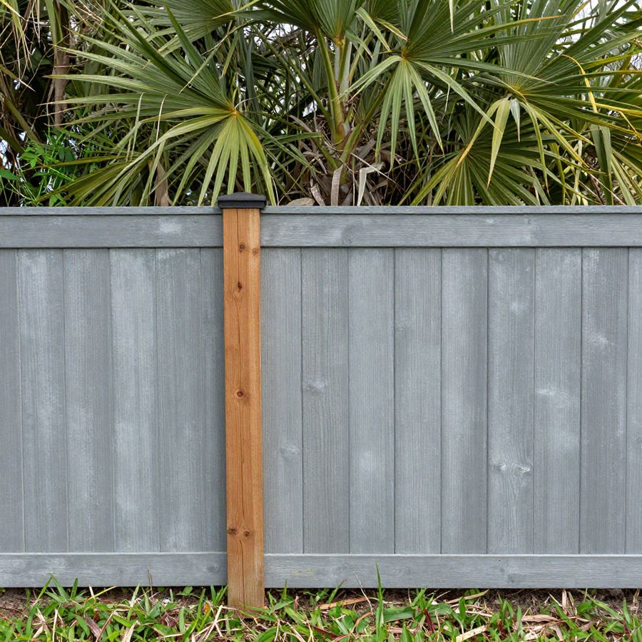 A backyard vinyl fence in Riverview near the kind of natural buffer the area's creeks run through